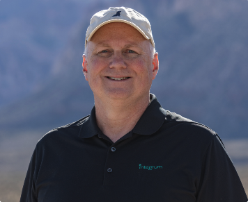 Portrait of Glenn, an OPRA™ Implant System patient, smiling outdoors.