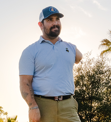 Male OPRA™ Implant System patient portrait outdoors in casual wear.