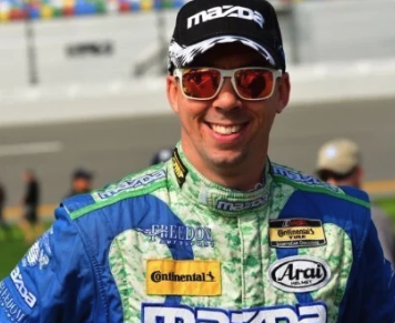 Portrait of LIAM, an OPRA™ Implant System patient, in full racing gear.
