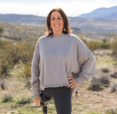 An OPRA™ Implant System patient posing in the desert.