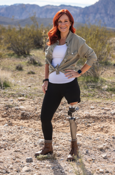 Stacy standing in desert.